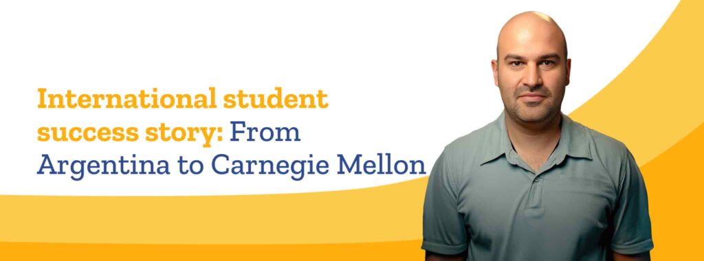 Argentinian international student Daniel Garaguso smiles at the camera, wearing a short-sleeved, gray shirt.